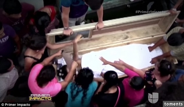 Tragedy: Ms Perez, who was three months pregnant, was buried in the wedding dress she recently used to get married. She was taken by truck to hospital still inside her coffin, but although medics tried to revive her, all the tests they carried out showed that she was clinically dead