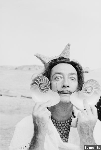 Salvador Dali embracing the weirdness we have all felt at one time or another.