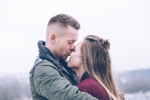 Man Holding Woman