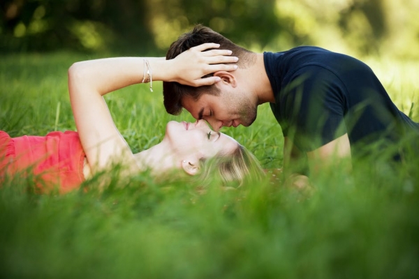 Couple Lying on Grass